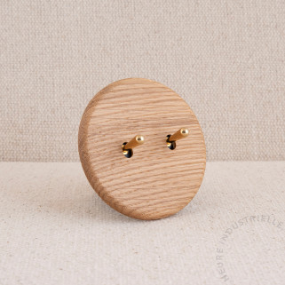 Interrupteur double Modelec Iris chêne clair levier laiton brillant